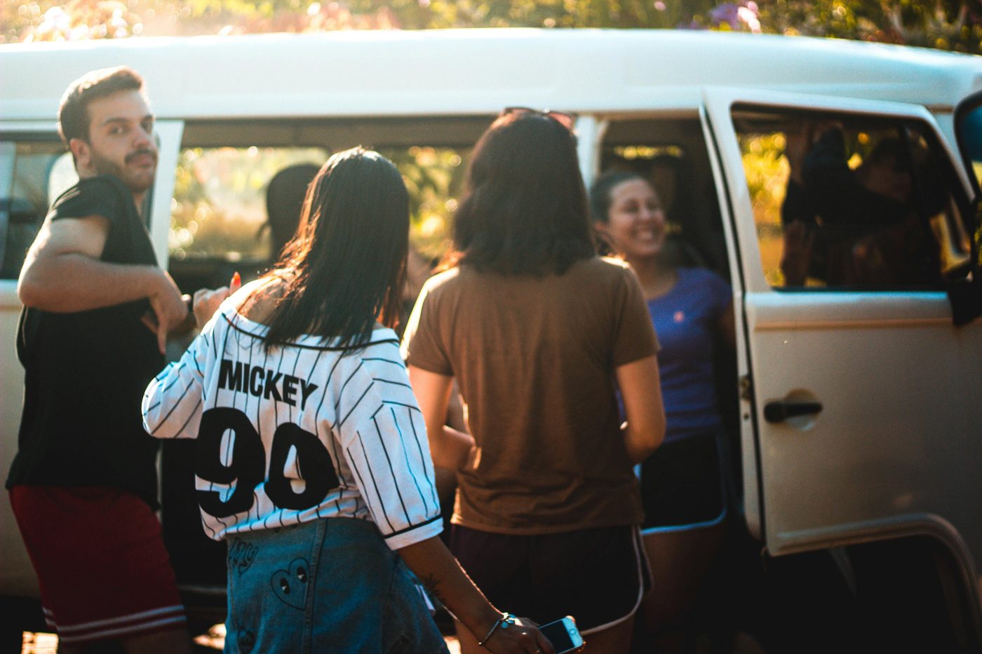 Friends piling into a van, heading out on an excursion together